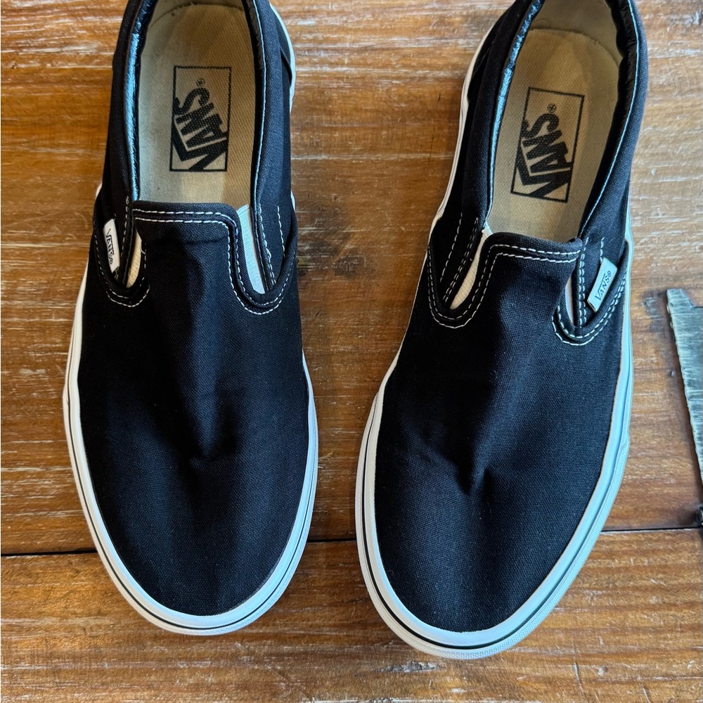Black Slip-On Sneakers by Vans